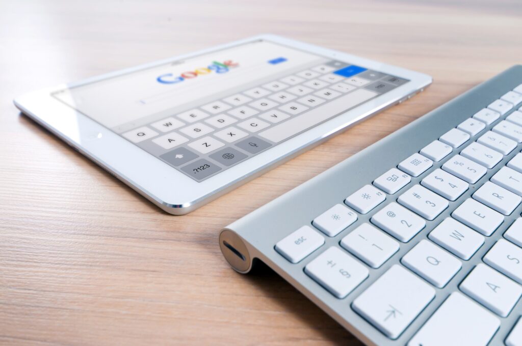 Tablet displaying google search engine and a keyboard attachment